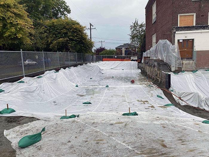 a construction site with material on the ground