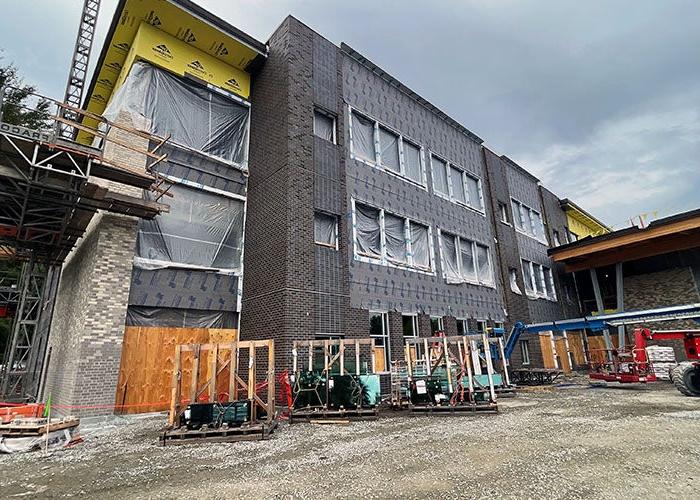 a building under construction with scaffolding and bricks on some of the walls